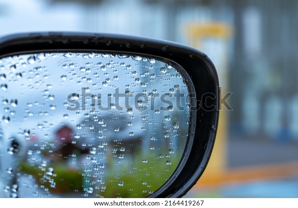 Water droplets\
on the side mirrors of the\
car.