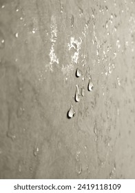 Water droplets sticking to the bathroom wall