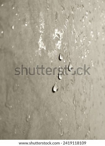 Water droplets sticking to the bathroom wall