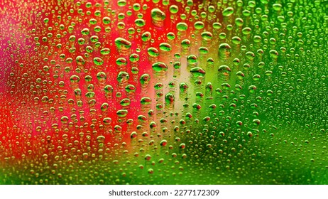 Water drops. Abstract gradient background. Colored drop texture. Green-red gradient. Heavily textured image. Shallow depth of field. Selective soft focus