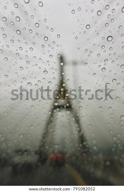 Water drops at the car glass
in raining day and traffic jam at Bhumibol Bridge in Bangkok,
Thailand.