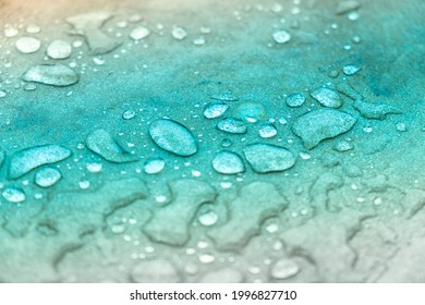 Water Drops Close Up On The Flat Rock Surface. Teal Gradient Abstract Background