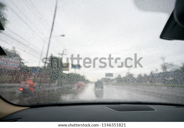 Water drops, drops of dew on a car\'s window in a\
rainy day, cause of\
accident