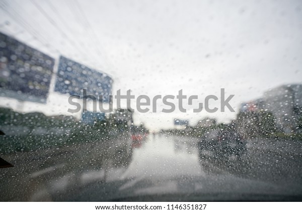 Water drops, drops of dew on a car's window in a
rainy day, cause of
accident