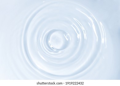 Water drops falling on water surface - Shutterstock ID 1919222432