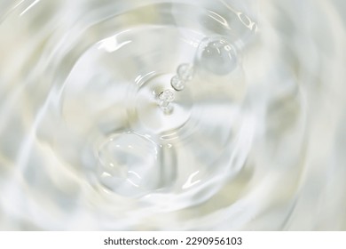 Water drops falling on water surface