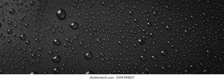 Water drops on a black background. Banner with raindrops. Top view. - Powered by Shutterstock