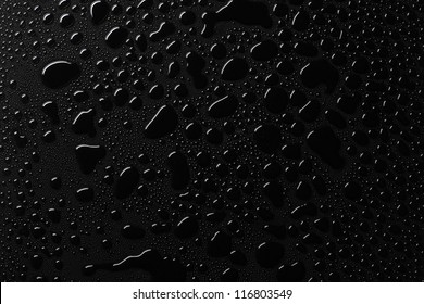 Water drops on black surface