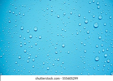 Water Drops On Blue Background. - Shutterstock ID 555605299