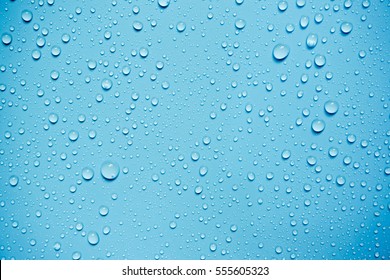 Water Drops On Blue Background. - Shutterstock ID 555605323