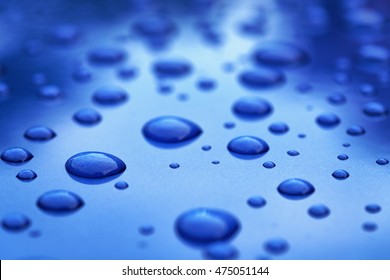 Water Drops On Blue Car Body Threated With Protective Coating, Closeup Photo