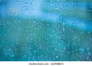 water drops on blue glass - Shutterstock ID 222908872