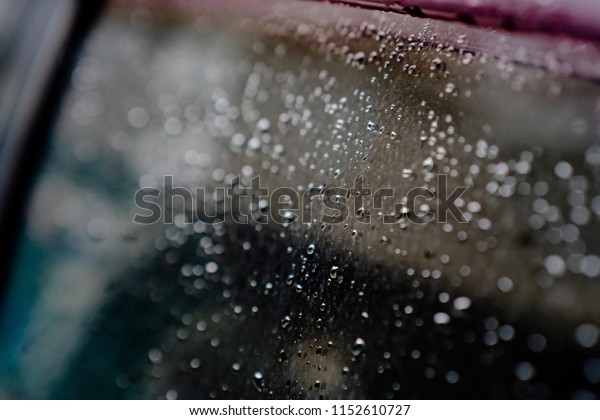 Water drops on car\
glass, wintage style.