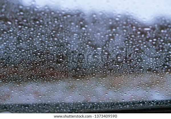 water drops on\
car glass, rain drops on\
glass