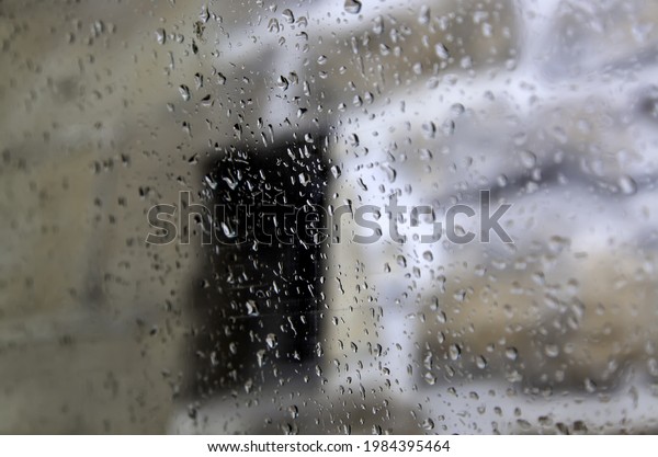 Water drops on car glass, rain and storm,\
background texture