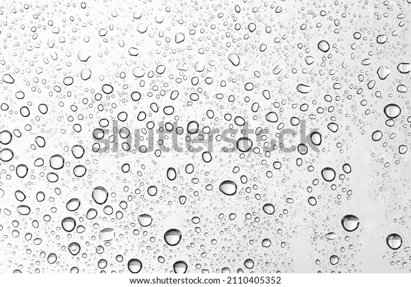 Water\
drops on car glass. Rain drops on the clear\
window.