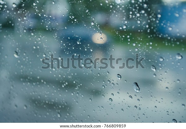 water\
drops on car glass windows, abstract\
background