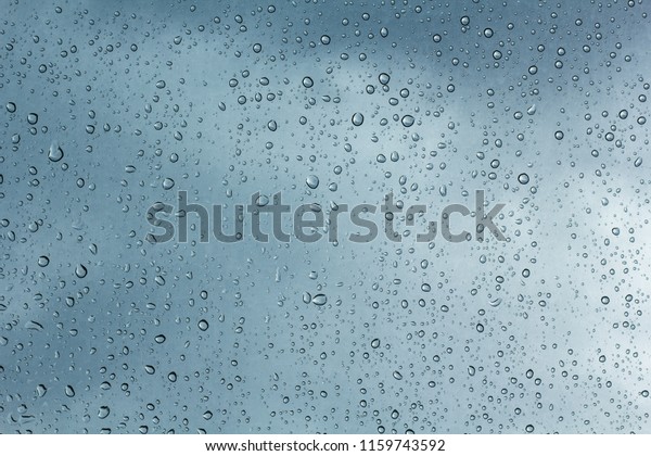 Water drops\
on car glass.rain drops on clear\
window