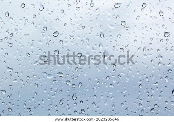 Water drops\
on car glass.rain drops on clear\
window