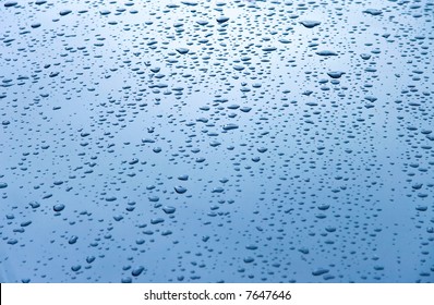 Water Drops On Car Hood. Blue Tint.