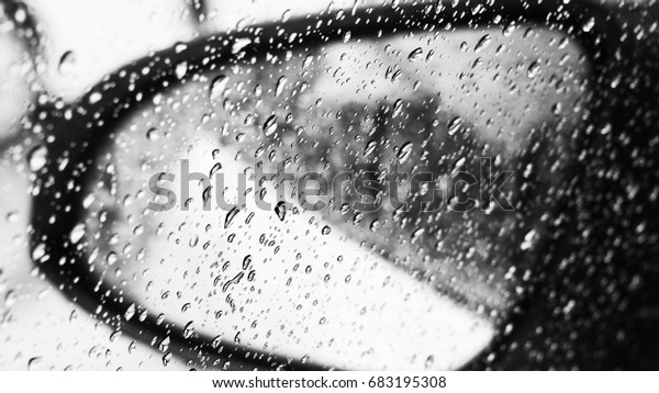 Water drops on car\
mirror
