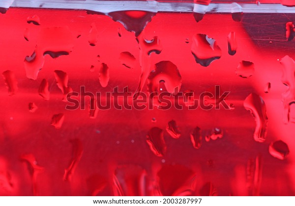 Water drops on a car red\
rear light