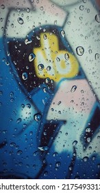 Water Drops On Car Window With Graffiti View