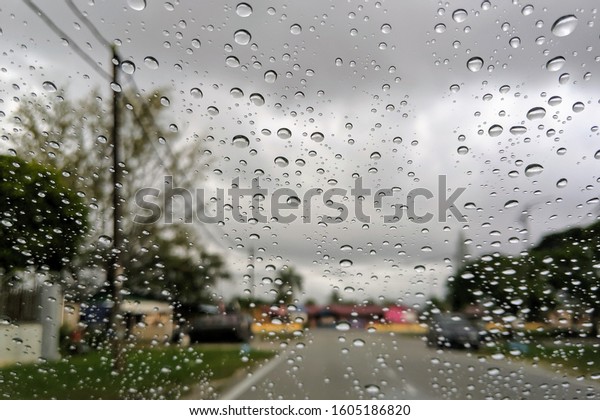 Water drops on car window,\
closeup