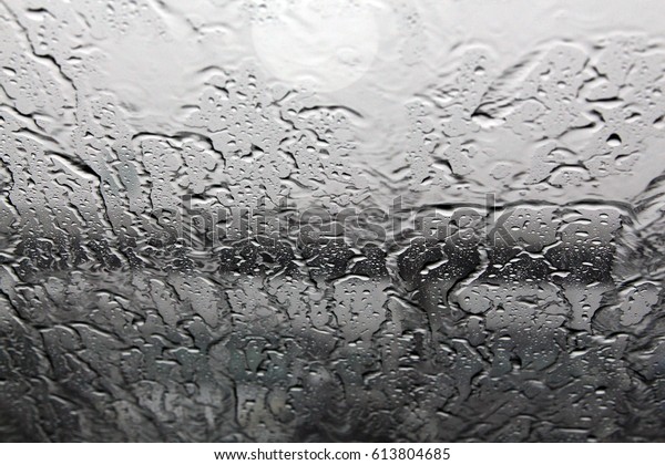 Water drops on the car window glass after\
rain with selected focus - depth of\
field
