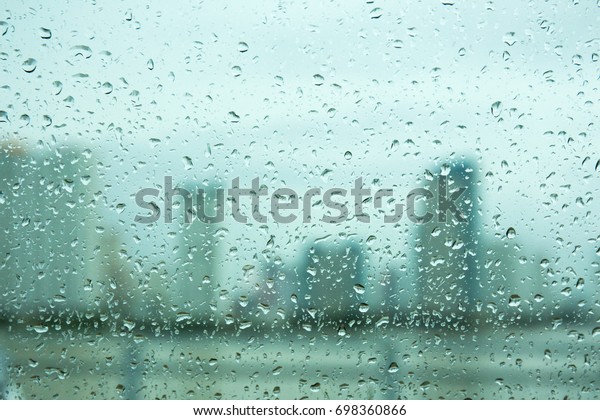 Water drops on car\
window glass in rain