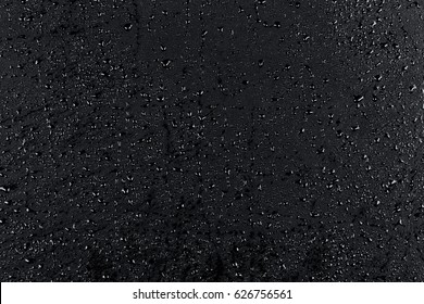 Water drops on dark stone surface texture background - Shutterstock ID 626756561