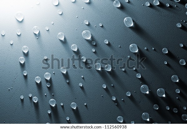Water\
drops on the embossed surface of tension\
ceiling