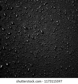 Water drops on the fabric texture. wet textile texture. cloth with water drops. moist fabric pattern.