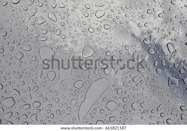 Water\
drops on the glass, bottom view, wet glass\
ceiling