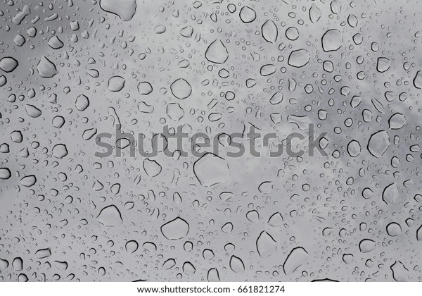 Water\
drops on the glass, bottom view, wet glass\
ceiling