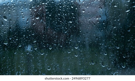 Water drops on glass window with autmn forest background - Powered by Shutterstock