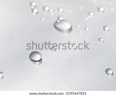 water drops on gray waterproof paper. Liquid texture.
