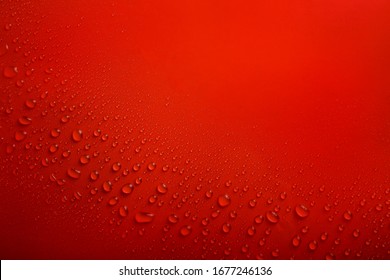 Water drops on red background
