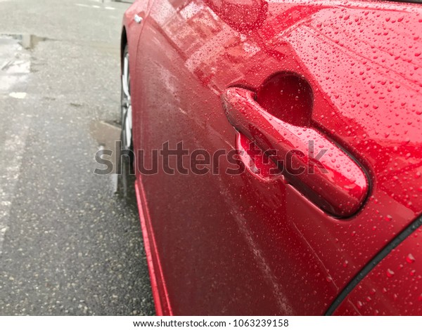 Water drops on red car\
body\
