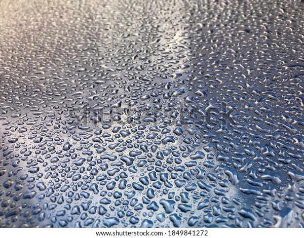 Water drops on the roof of the car. Weather\
changes and cold\
temperatures