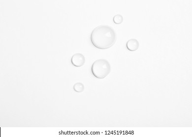 Water drops on white background, top view - Shutterstock ID 1245191848