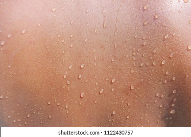 Water drops on woman skin, close up of wet human skin texture
                             