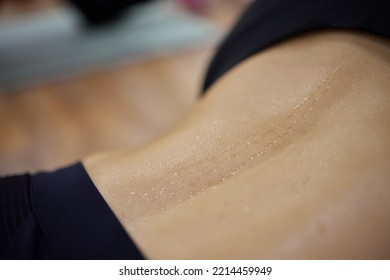 Water Drops On The Woman Skin. Human Skin And Sweat. Close Up Of Wet Human Skin.