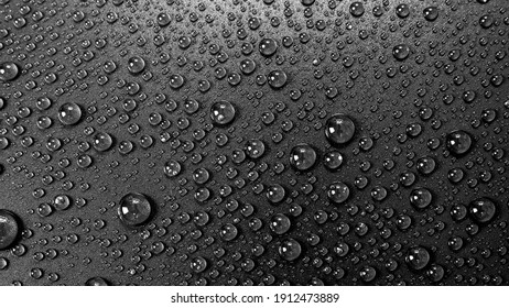 Water drops rain or droplet on black background.
Condensation is the process of a substance in a gaseous state transforming liquid.