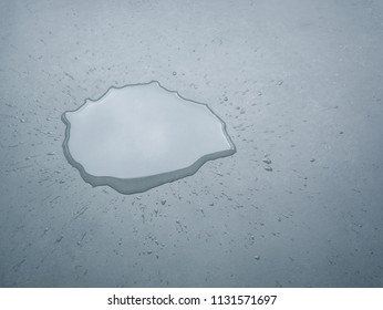 Water Drops Splash On The Floor, Dark Color Tone, Abstract Background And Selective Focus
