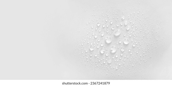 water drops of transparent gel serum on gray background