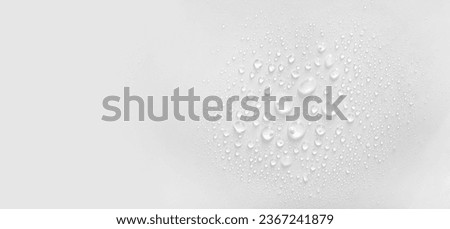 water drops of transparent gel serum on gray background