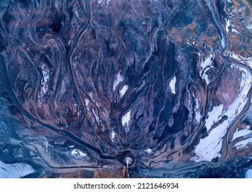 Water Erosion In Ash Deposit Pool Of Coal Power Plant In Winter. Aerial View Of Abstract Shapes. Shades Of Blue And Pink.