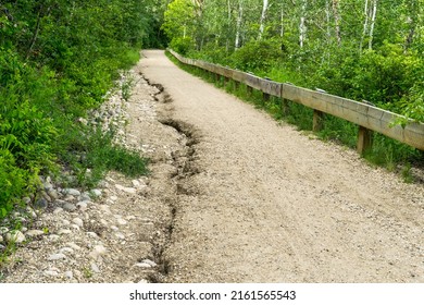 Water Erosion On The Gravel City Park  Trail Path