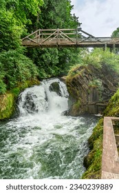 Water explodes through the lower section of Tumwater Falls in Tumwater, Washington.